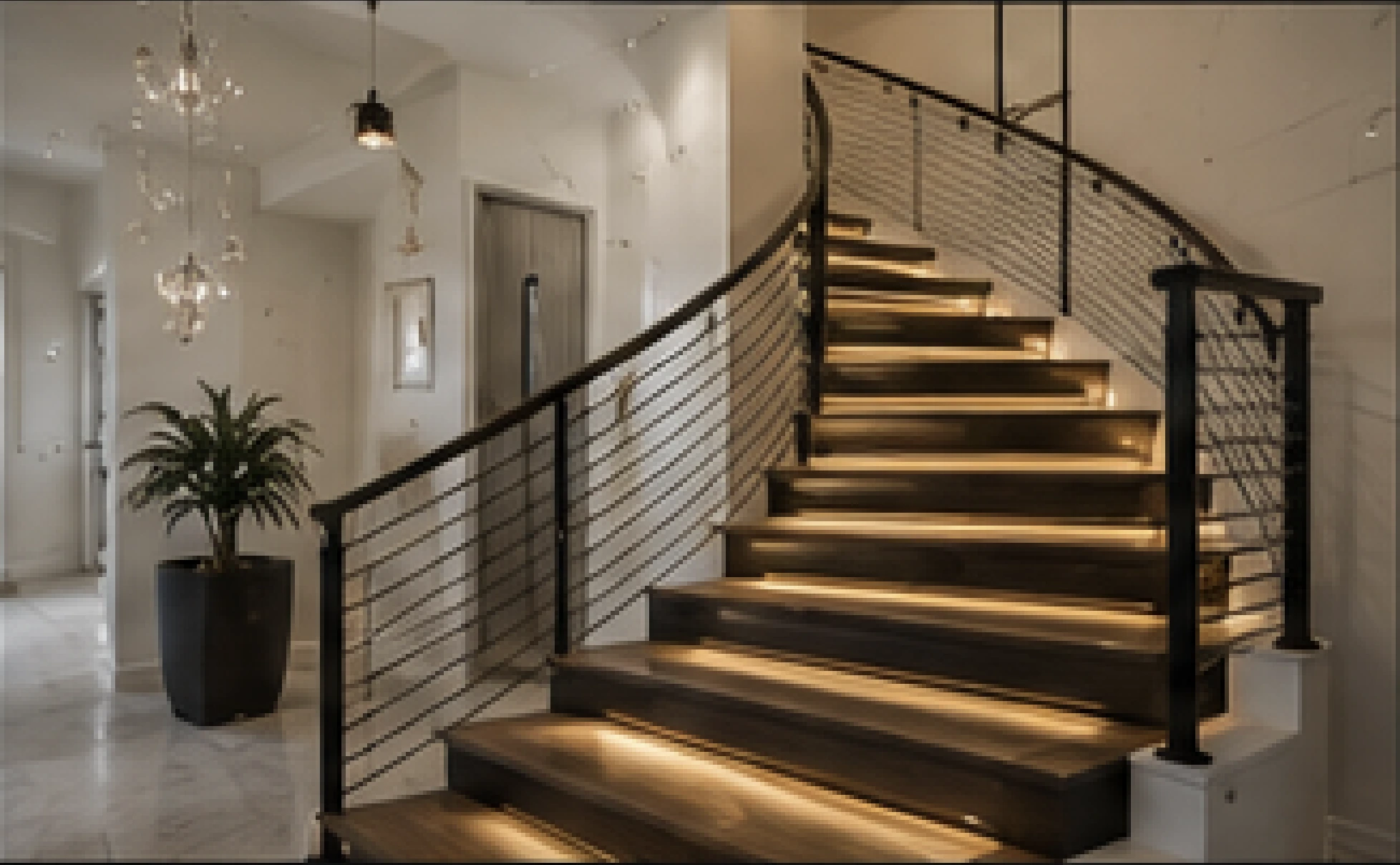 Curved luxury staircase with warm integrated lighting